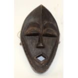 A TRIBAL DAN MASK. Ivory Coast. 14cm x 8cm x 24cm