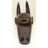 A TRIBAL AFRICAN MASK. 23cm x 18cm x 58cm