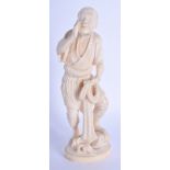 A 19TH CENTURY JAPANESE MEIJI PERIOD CARVED IVORY OKIMONO modelled as a fisherman. 20 cm high.