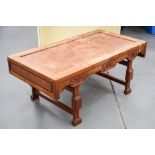 A CHINESE CARVED HARDWOOD LOW TABLE. 88 cm x 37 cm.