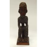 A TRIBAL BAMILEKE BEADED FIGURE. Cameroon. 14cm x 15cm x 50cm