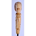 A 19TH CENTURY EUROPEAN CARVED IVORY CANE HANDLE. Ivory 12.75 cm long.