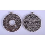 A PAIR OF CHINESE WHITE METAL PENDANTS. 2.25 cm wide.