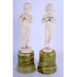 A GOOD PAIR OF ART DECO CARVED IVORY FIGURES BY A BOY AND GIRL C1920 by Ferdinand Preiss (1882-1943)