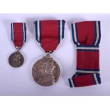A 1935 GEORGE V SILVER JUBILEE MEDAL with miniature and ribbons. (3)