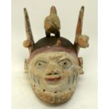 A TRIBAL YORUBA GELEDE HELMET MASK. Nigeria. 18cm x 25cm x 27cm