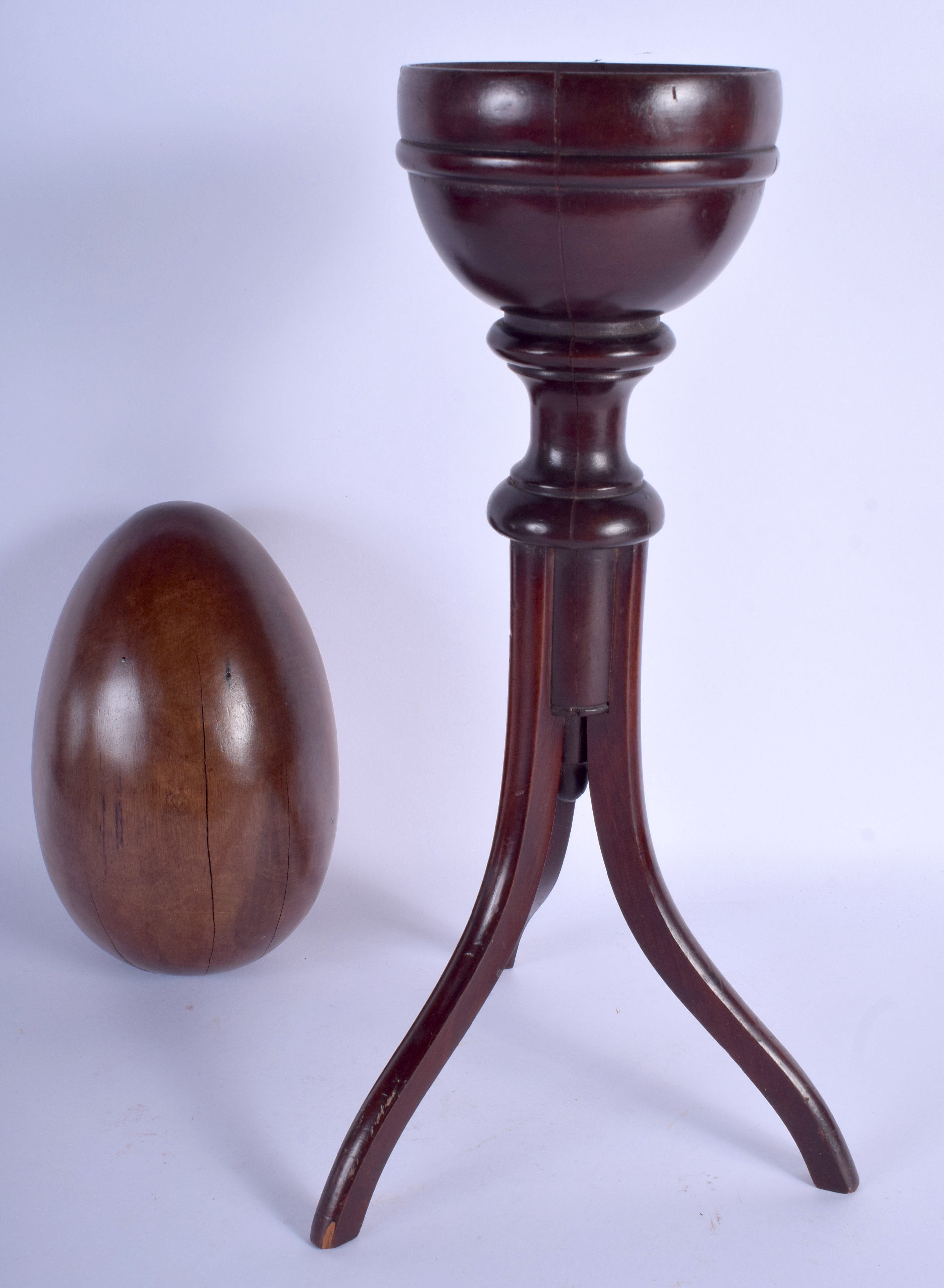 A LARGE ANTIQUE LIGNUM VITAE SPECIMAN EGG upon a stand. 55 cm high. - Image 2 of 2