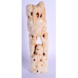 A 19TH CENTURY JAPANESE MEIJI PERIOD CARVED IVORY OKIMONO modelled with numerous roaming monkeys. 17