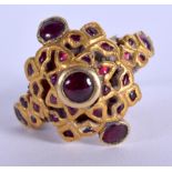 AN ANTIQUE MIDDLE EASTERN HIGH CARAT GOLD AND RUBY RING. 8.1 grams. M.