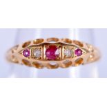 AN 18CT GOLD DIAMOND AND RUBY RING. N. 2.4 grams.