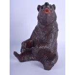 AN EARLY 20TH CENTURY BAVARIAN BLACK FOREST BEAR TOBACCO JAR AND COVER. 21 cm high.