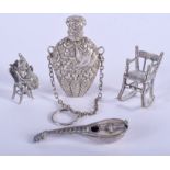 AN ANTIQUE SILVER SCENT BOTTLE together with three other silver items. (4)