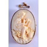 AN ANTIQUE CONTINENTAL GOLD AND IVORY BROOCH. 18.2 grams. 4 cm x 5.5 cm.