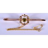 A LATE VICTORIAN 15CT GOLD PERIDOT AND SEED PEARL BROOCH. 4.4 grams. 5.5 cm widw.