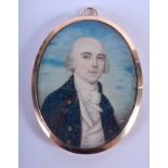 A GEORGE III PAINTED IVORY PORTRAIT MINIATURE depicting a male wearing a blue coat. 5 cm x 6.25 cm.