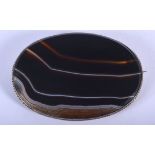 A LARGE VICTORIAN SILVER MOUNTED BANDED AGATE BROOCH. 10 cm x 7 cm.