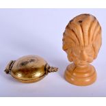 A VINTAGE CARVED NATIVE AMERICAN NUT PORTRAIT together with a beetle nut box. (2)