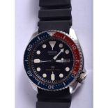 A SEIKO BLACK PEPSI DIAL WRISTWATCH. 3.5 cm wide.