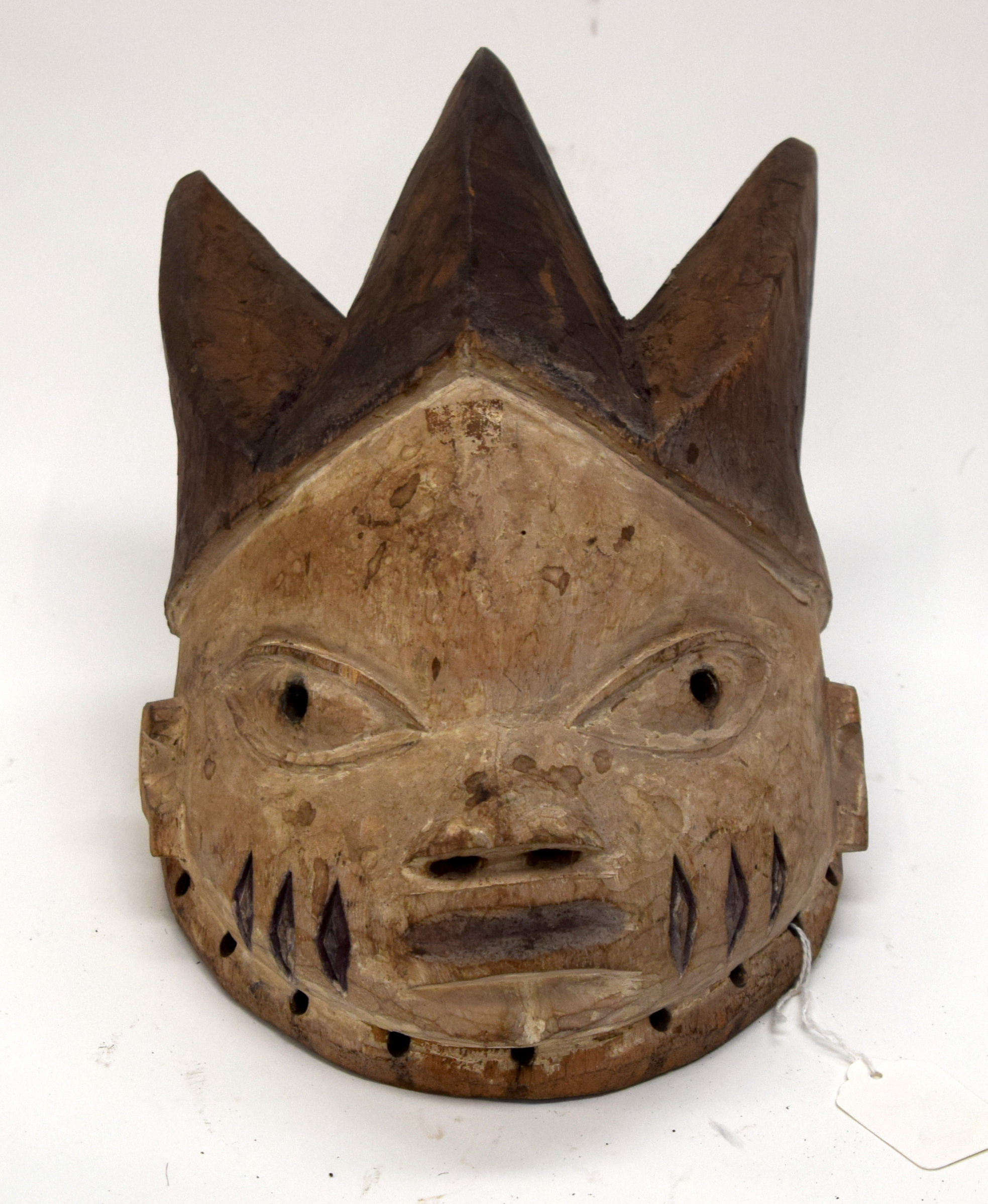 A TRIBAL YORUBA MASK. Nigeria. 17cm x 19cm x 28cm