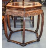 AN EARLY 20TH CENTURY CHINESE HARDWOOD HEXAGONAL TABLE upon splayed legs. 63 cm x 57 cm.