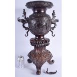 A LARGE 19TH CENTURY JAPANESE MEIJI PERIOD TWIN HANDLED BRONZE VASE upon a finely carved wooden stan