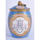 A 19TH CENTURY FRENCH SEVRES PORCELAIN PRESERVE JAR AND COVER painted with foliage. 11 cm high.