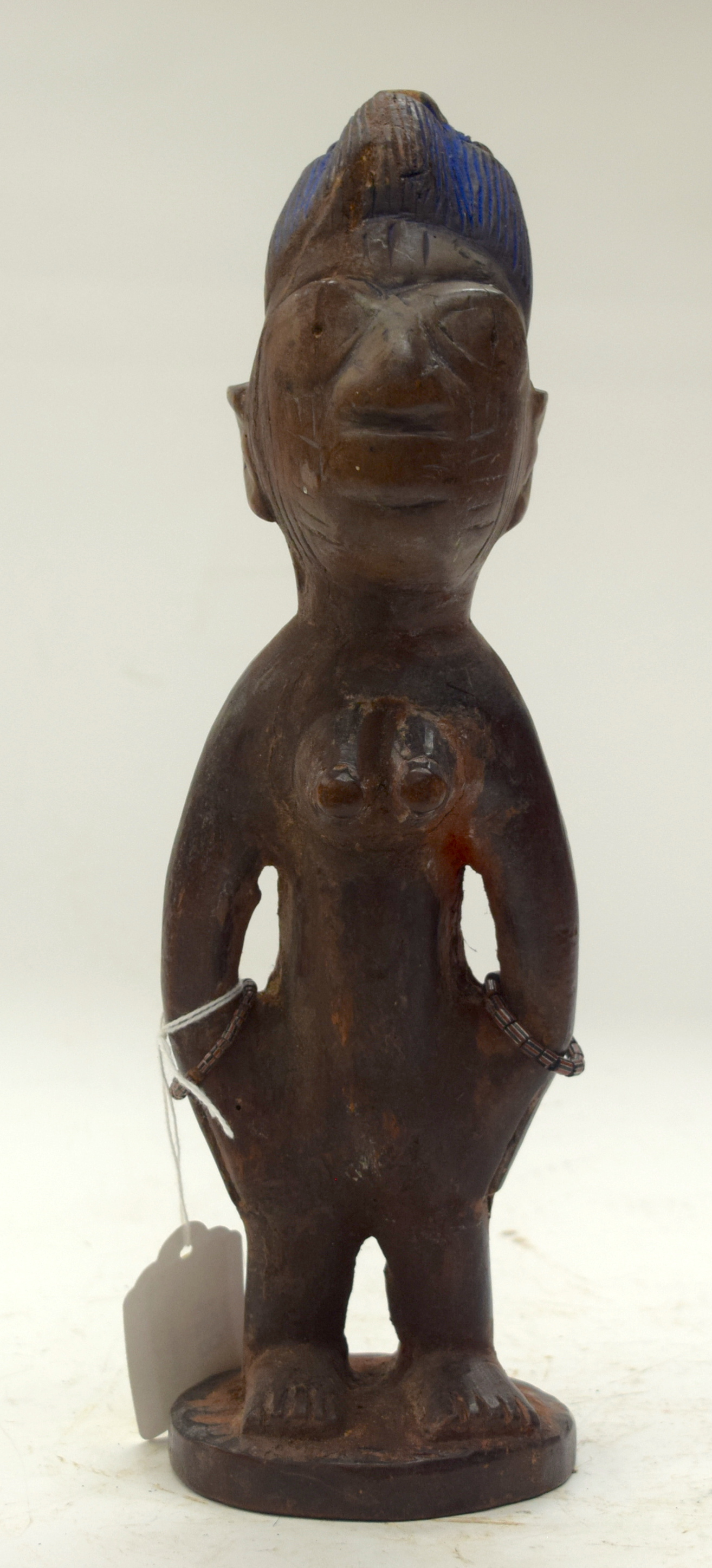 A TRIBAL YORUBA IBEJI FIGURE. Nigeria. 8cm x 8cm x 28cm