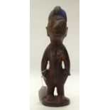 A TRIBAL YORUBA IBEJI FIGURE. Nigeria. 8cm x 8cm x 28cm