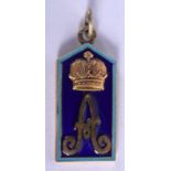 A CONTINENTAL SILVER AND ENAMEL CROWN PENDANT. 2 cm x 3.5 cm.