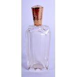 AN ANTIQUE GOLD AND CRYSTAL GLASS SCENT BOTTLE. 9 cm high.