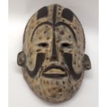 A TRIBAL IGBO MASK. Nigeria. 18cm x 12cm x 28cm