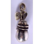 A CONTINENTAL SILVER HELMET PENDANT. 3.5 cm x 2 cm.