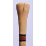 AN EARLY 19TH CENTURY CARVED IVORY AND WHALEBONE WALKING CANE. 84 cm long.