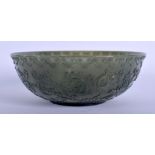 A MIDDLE EASTERN ISLAMIC MUGHAL TYPE JADE BOWL decorated with scrolling foliage. 13.5 cm wide.