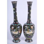 A PAIR OF 19TH CENTURY JAPANESE MEIJI PERIOD CLOISONNE ENAMEL VASES decorated with butterflies. 19 c