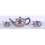 A VICTORIAN SILVER TEASET. London 1882. 31 oz. Largest 23 cm wide. (3)