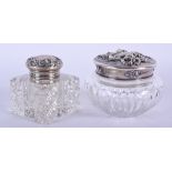 TWO ANTIQUE SILVER TOPPED SCENT BOTTLES. (2)