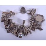 A VINTAGE SILVER CHARM BRACELET. 99 grams.