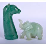 AN EARLY 20TH CENTURY PERSIAN JADE FLUORITE DAGGER HANDLE and an elephant. Largest 12 cm long. (2)