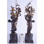 A LARGE PAIR OF 19TH CENTURY FRENCH BRONZE FIGURE OF PUTTI modelled holding aloft floral branches. 5