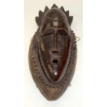 A TRIBAL YAURE MASK. Ivory Coast. 90cm x 16cm x 43cm