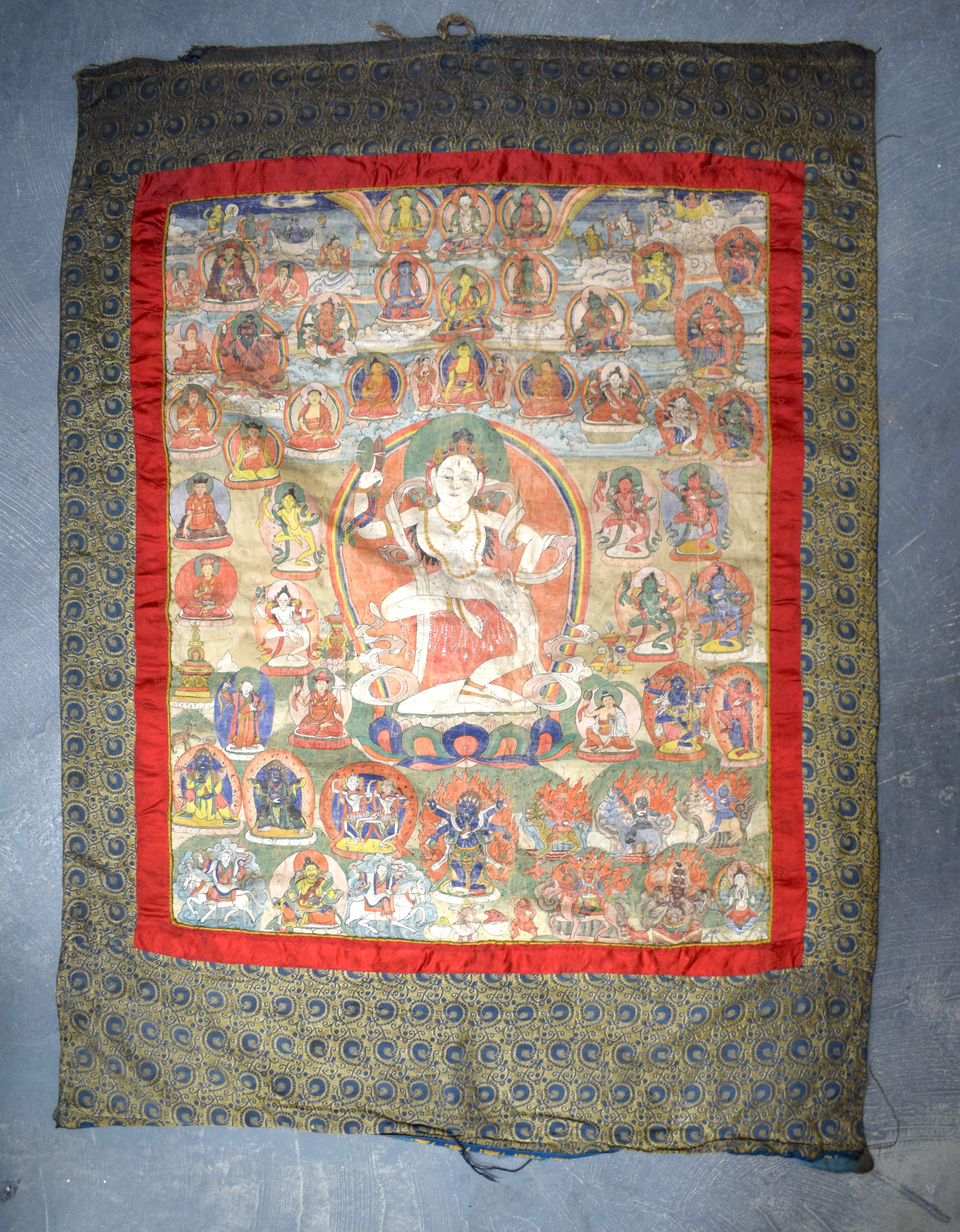A 19TH CENTURY TIBETAN THANGKA depicting dakini, the white figure dancing upon a lotus, surrounded b