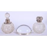 TWO ANTIQUE SILVER AND CUT GLASS SCENT BOTTLES and a paperweight. (3)