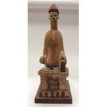 A TRIBAL YOROUBA FIGURE. Nigeria. 20cm x 36cm x 55cm