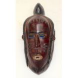 A TRIBAL GURO MASK. Ivory Coast. 13cm x 14cm x 33cm