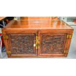 A 19TH CENTURY CHINESE HONGMU BRASS BOUND CABINET decorated with figures. 120 cm x 60 cm.