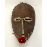 A TRIBAL DAN MASK. Ivory Coast. 13cm x 11cm x 27cm