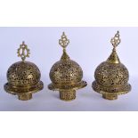THREE 19TH CENTURY MIDDLE EASTERN QAJAR BRASS OPEN WORK LAMPS decorated with birds. Largest 24 cm x