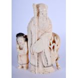 A 19TH CENTURY JAPANESE MEIJI PERIOD CARVED IVORY FIGURE OF SAGE modelled beside a deer. 14 cm x 7 c