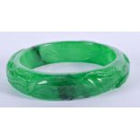 A CHINESE CARVED GREEN JADE BANGLE 20th Century. 7 cm wide.